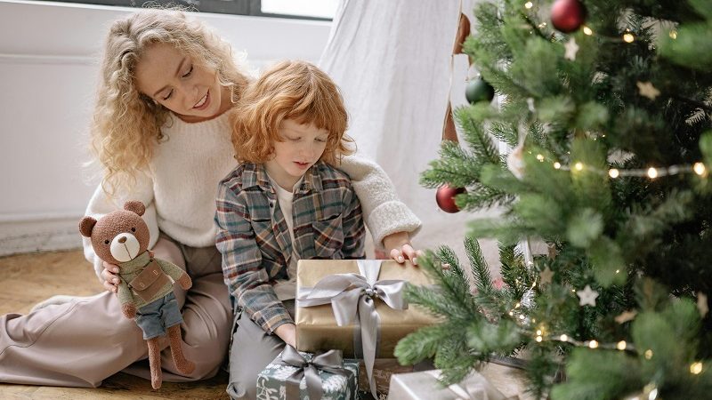 Parent giving gifts to their kid