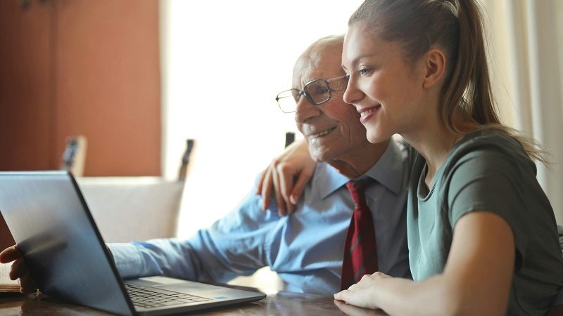 Daughter helping her elderly father with his special needs trust