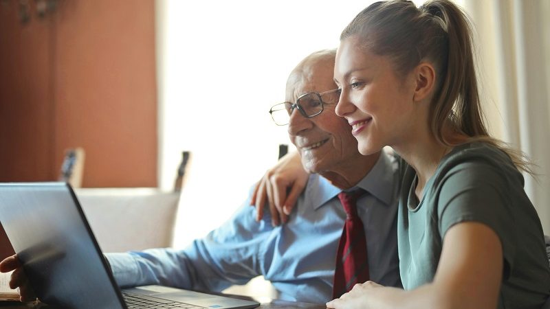 Daughter helping her father with his will