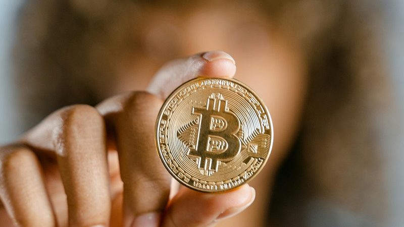 Women holding a bitcoin