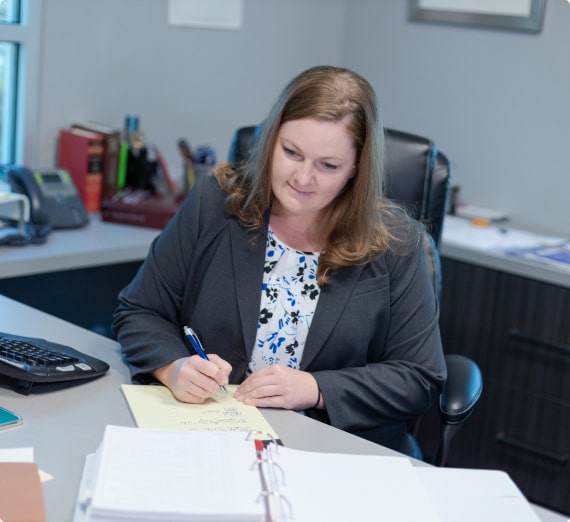 A criminal defense lawyer works at her desk